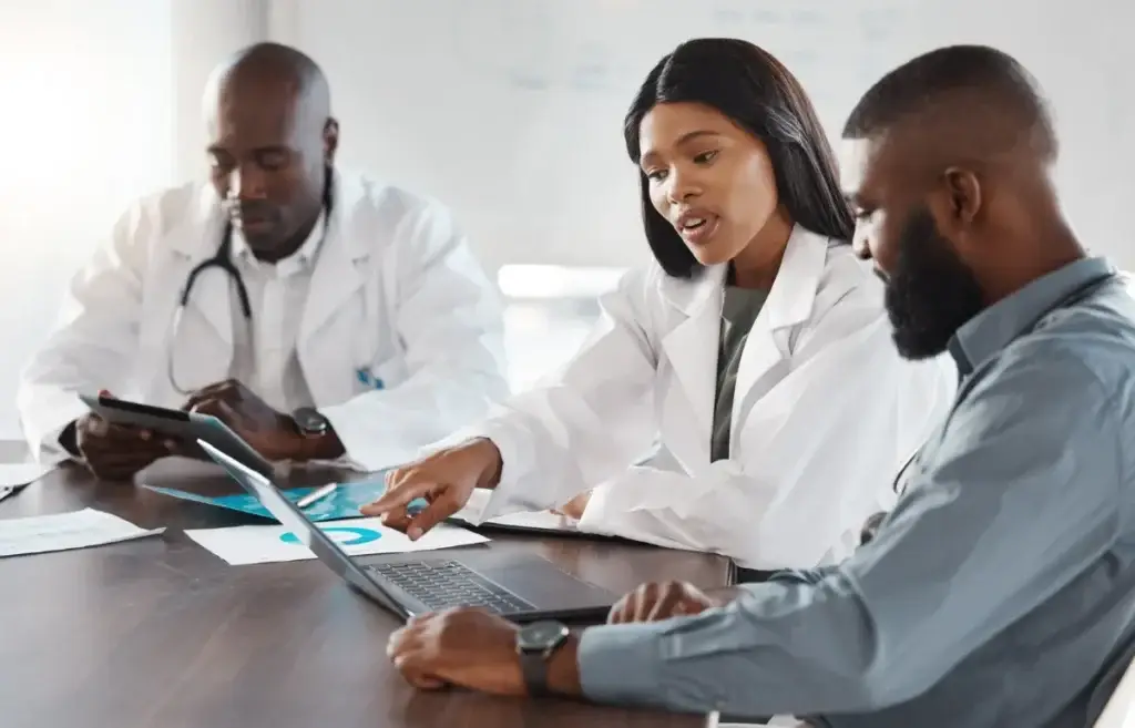 Vascular care team reviewing a treatment plan with a patient